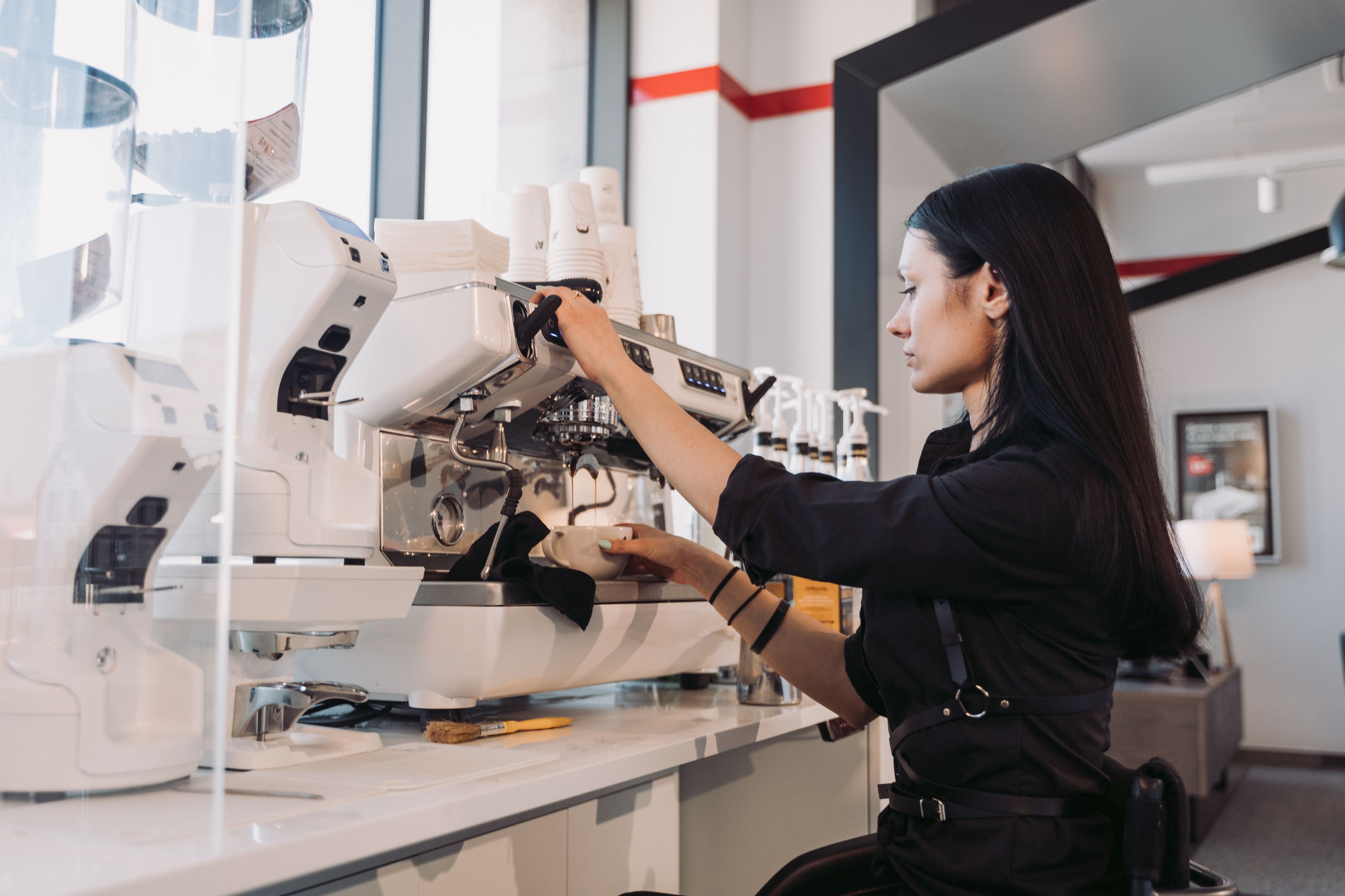 Barista preparing equipment during a practical coffee training session